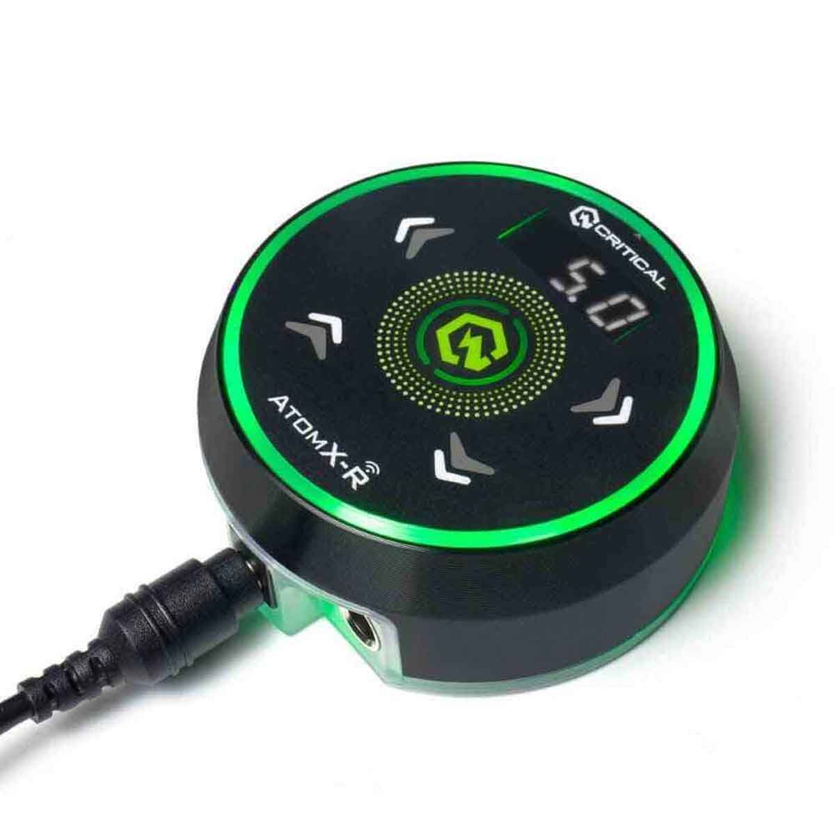 Round electronic device with green accents and 'Critical' branding on a white background