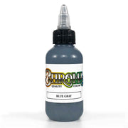 Bottle of blue gray tattoo ink with a visible brand label on a white background