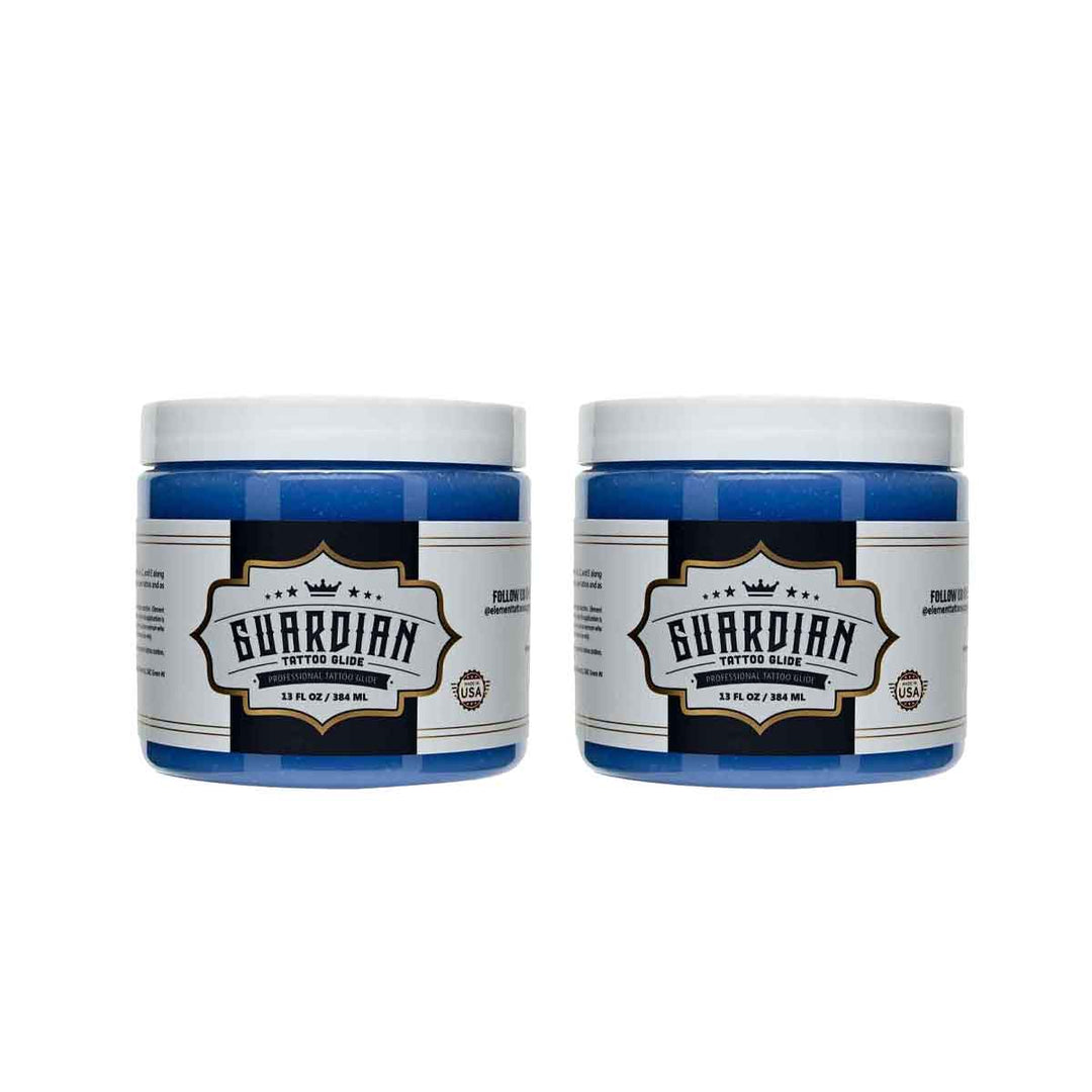 Two jars of Guardian tattoo glide on a white background