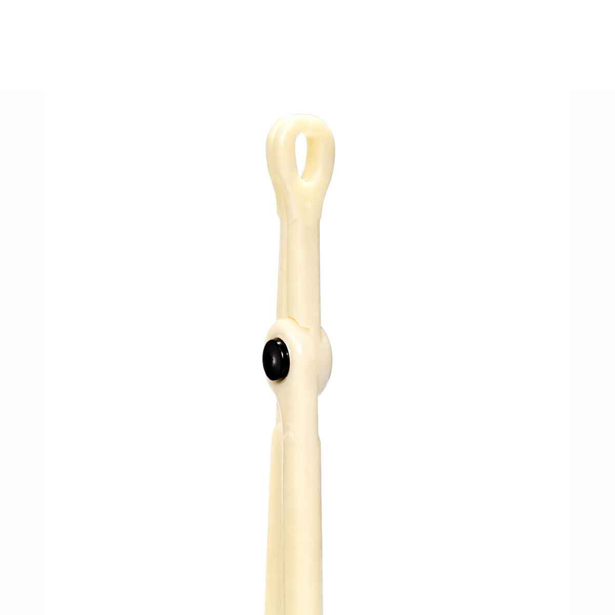 White piercing navel clamp with a black bead on a white background